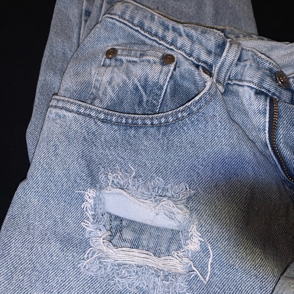 Light wash, ripped, high waist jeans. 6